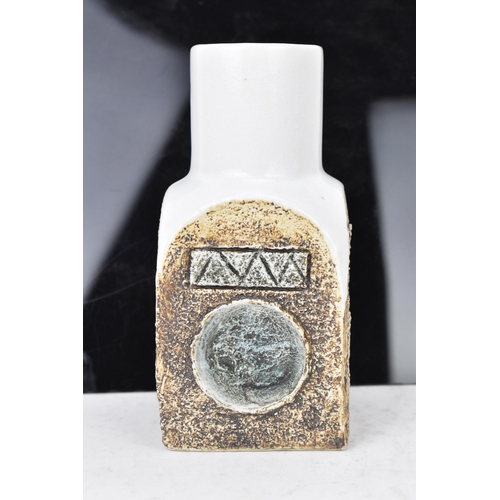 45 - A Troika pottery spice jar by Sue Lowe, the four sides with incised geometric designs on a white gro... 