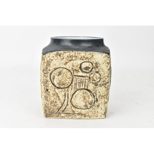 49 - A Troika marmalade jar by Eleanor Winning, the four sides with incised geometric designs, signed Tro... 