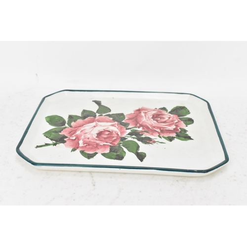 52 - An early 20th century Wemyss pottery comb tray, of octagonal form and painted with cabbage roses to ... 