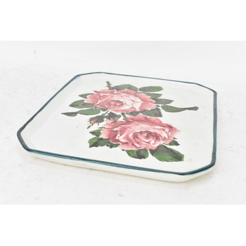 52 - An early 20th century Wemyss pottery comb tray, of octagonal form and painted with cabbage roses to ... 