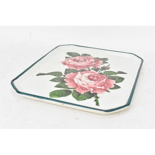 52 - An early 20th century Wemyss pottery comb tray, of octagonal form and painted with cabbage roses to ... 