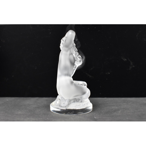 56 - A Lalique 'Floreal' frosted art glass study of a nude female seated, signed Lalique France to the ba... 