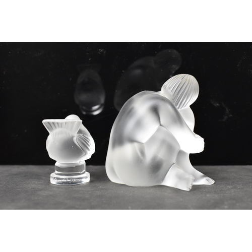 57 - A Lalique 'Nu Sage' frosted glass figure in the form of a seated nude, 7cm high x 7cm wide, together... 