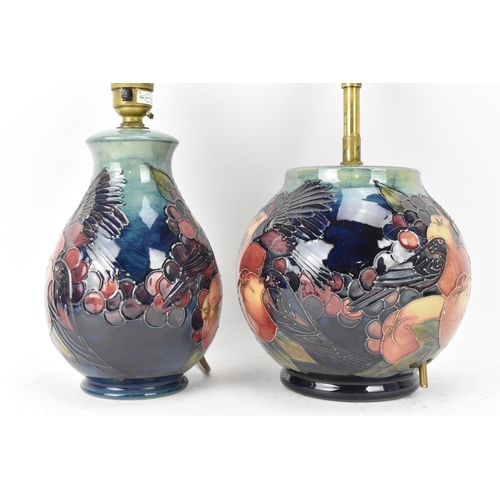 6 - Two Moorcroft pottery 'Finches and Fruit' pattern table lamps, designed by Sally Tuffin, each of bal... 