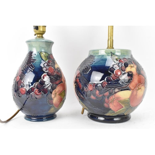 6 - Two Moorcroft pottery 'Finches and Fruit' pattern table lamps, designed by Sally Tuffin, each of bal... 