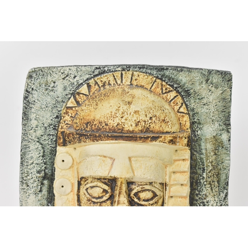 65 - A Troika pottery Aztec Mask by Tina Doubleday, both sides moulded in high relief with stylised faces... 