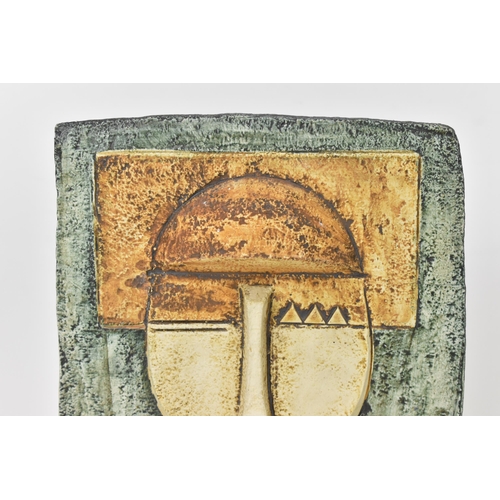 65 - A Troika pottery Aztec Mask by Tina Doubleday, both sides moulded in high relief with stylised faces... 