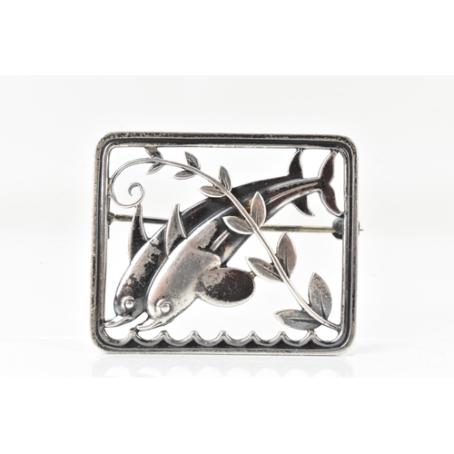 67 - A Georg Jensen silver twin dolphin brooch, design no. 251, the rectangular frame with a pair of leap... 