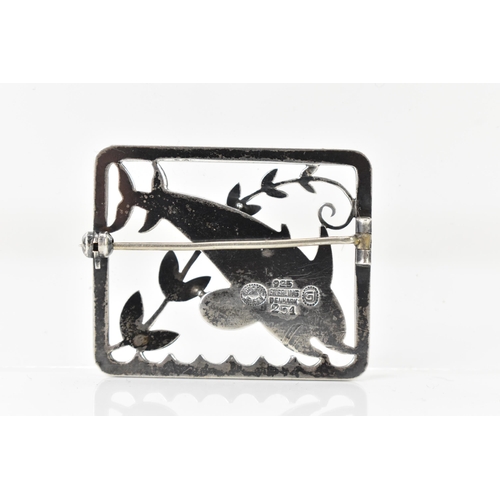 67 - A Georg Jensen silver twin dolphin brooch, design no. 251, the rectangular frame with a pair of leap... 