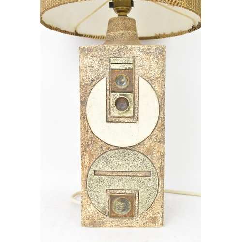 71 - A Troika pottery lamp base by Penny Black, of rectangular form with Aztec designs on a textured brow... 