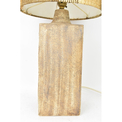 71 - A Troika pottery lamp base by Penny Black, of rectangular form with Aztec designs on a textured brow... 