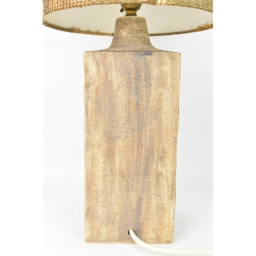 71 - A Troika pottery lamp base by Penny Black, of rectangular form with Aztec designs on a textured brow... 