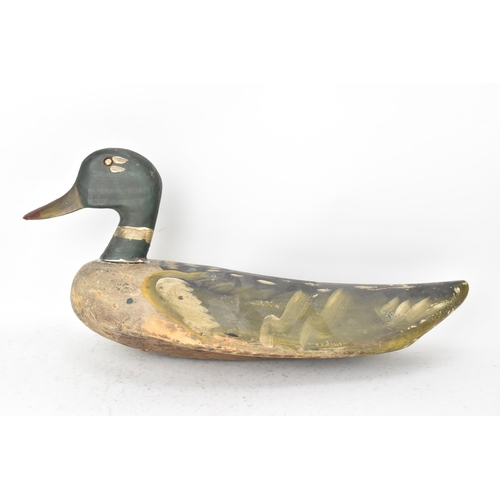 75 - A vintage carved and hand painted wooden duck decoy, 25cm high x 55cm wide