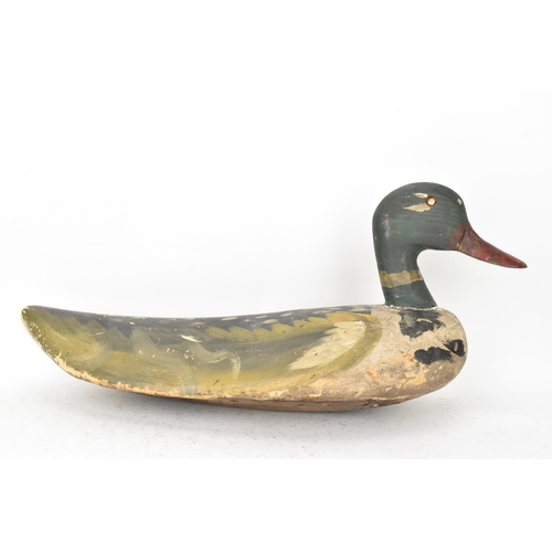 75 - A vintage carved and hand painted wooden duck decoy, 25cm high x 55cm wide