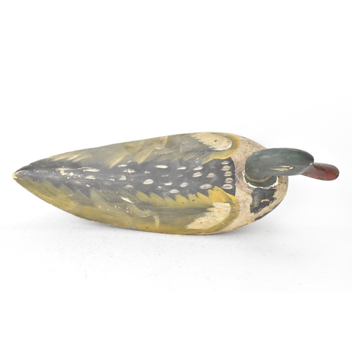 75 - A vintage carved and hand painted wooden duck decoy, 25cm high x 55cm wide