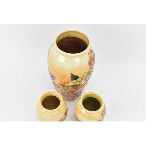 8 - Three Moorcroft pottery 'Finches Ochre' pattern vases, designed by Sally Tuffin, circa 1990, each of... 