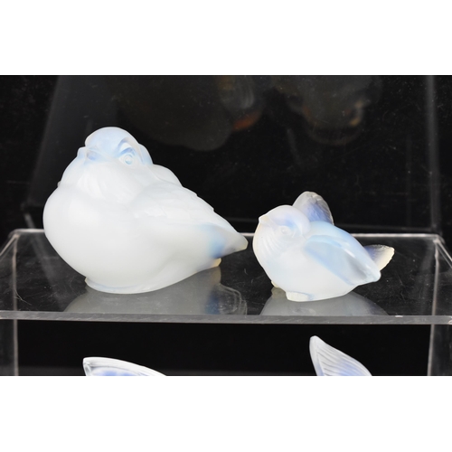 85 - Four Art Deco Sabino opalescent glass models, including a fish 7cm high x 10.5cm wide, a bird in fli... 