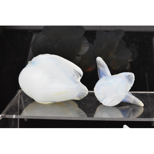 85 - Four Art Deco Sabino opalescent glass models, including a fish 7cm high x 10.5cm wide, a bird in fli... 