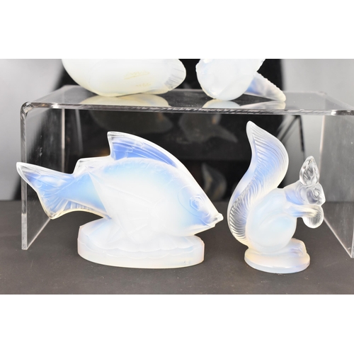 85 - Four Art Deco Sabino opalescent glass models, including a fish 7cm high x 10.5cm wide, a bird in fli... 