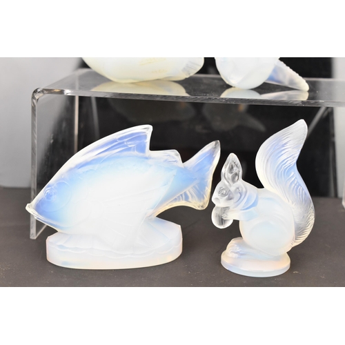 85 - Four Art Deco Sabino opalescent glass models, including a fish 7cm high x 10.5cm wide, a bird in fli... 