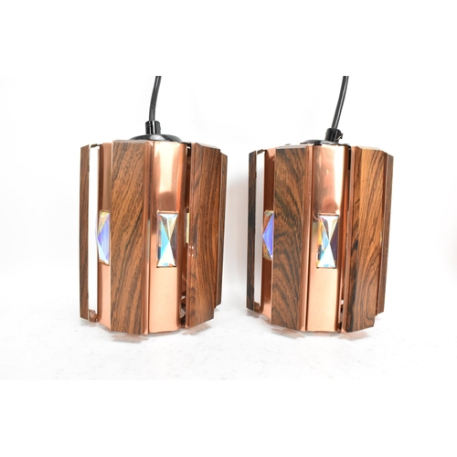 87 - A pair of 1960s Danish Werner Schou for Cornell Elektro afromosia and copper hanging lanterns, each ... 