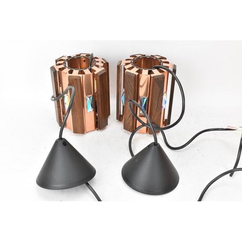 87 - A pair of 1960s Danish Werner Schou for Cornell Elektro afromosia and copper hanging lanterns, each ... 