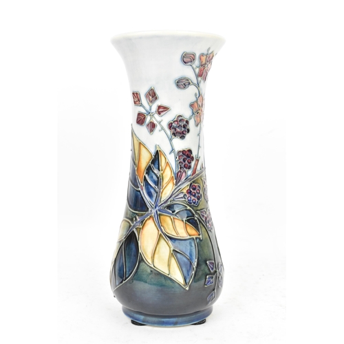 89 - A Moorcroft pottery 'Bramble' pattern table vase, dated 1993, of slender baluster form tube lined wi... 