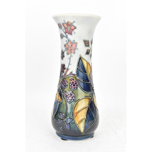 89 - A Moorcroft pottery 'Bramble' pattern table vase, dated 1993, of slender baluster form tube lined wi... 