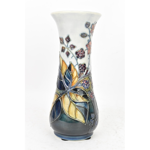 89 - A Moorcroft pottery 'Bramble' pattern table vase, dated 1993, of slender baluster form tube lined wi... 