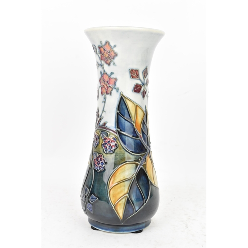 89 - A Moorcroft pottery 'Bramble' pattern table vase, dated 1993, of slender baluster form tube lined wi... 