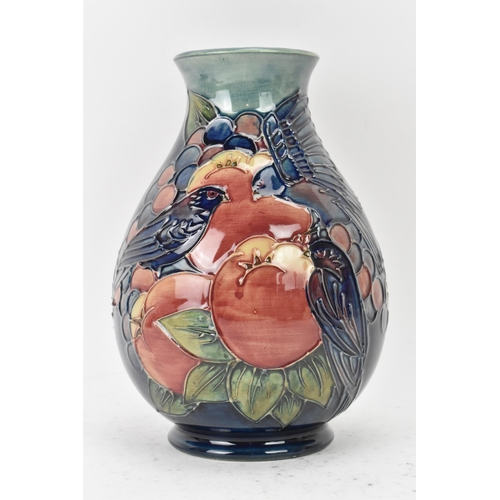 9 - A Moorcroft pottery 'Finches and Fruit' pattern vase, designed by Sally Tuffin, of baluster form wit... 