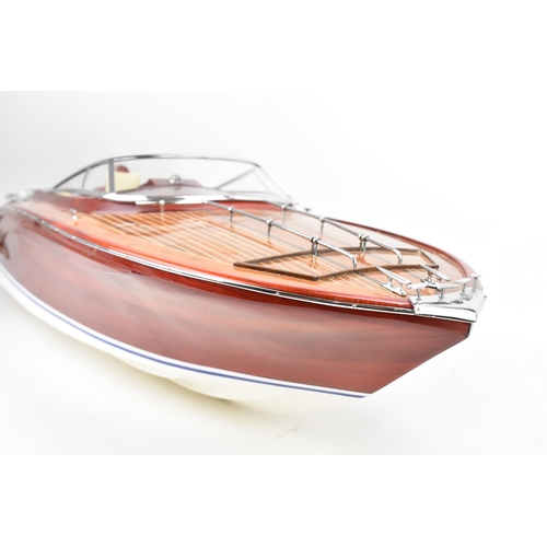 93 - A scale model of a Riva Rama speedboat, varnish finished with cream leather upholstered seats and ch... 