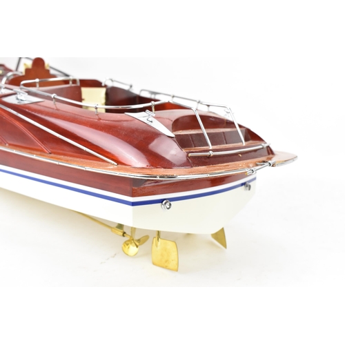 93 - A scale model of a Riva Rama speedboat, varnish finished with cream leather upholstered seats and ch... 