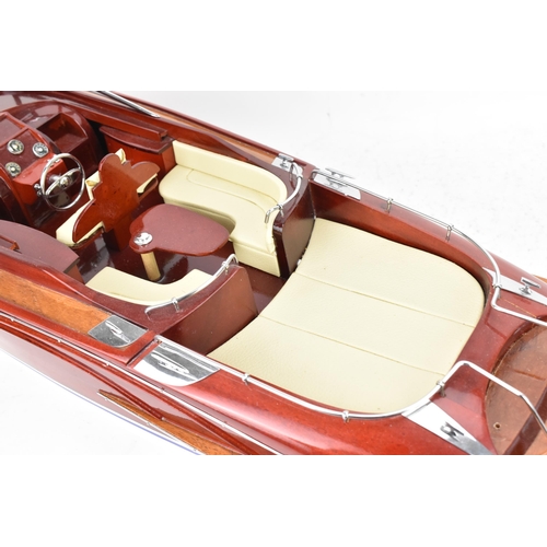 93 - A scale model of a Riva Rama speedboat, varnish finished with cream leather upholstered seats and ch... 