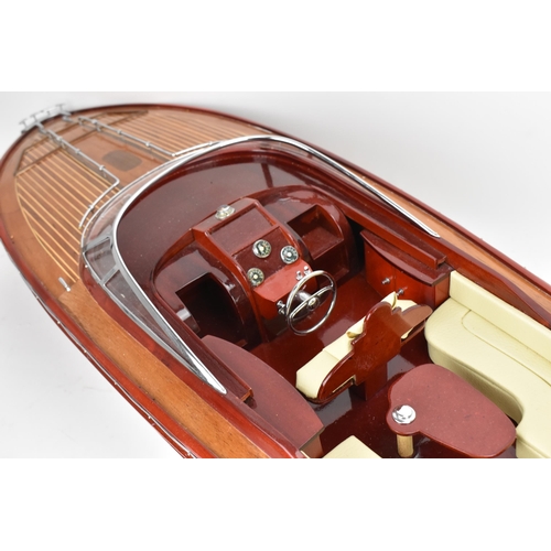 93 - A scale model of a Riva Rama speedboat, varnish finished with cream leather upholstered seats and ch... 