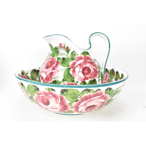 94 - An early 20th century Wemyss 'Cabbage Roses' pattern wash jug and bowl, painted in polychrome with f... 