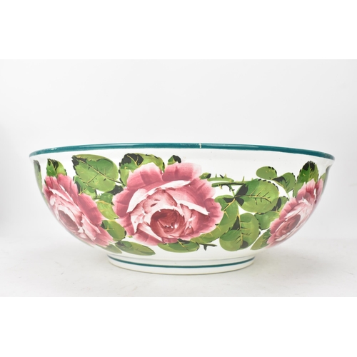 94 - An early 20th century Wemyss 'Cabbage Roses' pattern wash jug and bowl, painted in polychrome with f... 