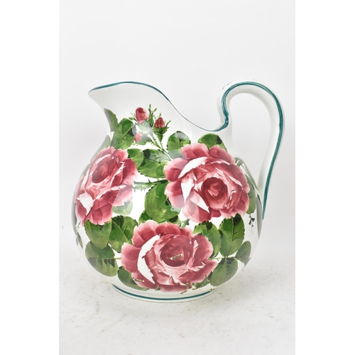 94 - An early 20th century Wemyss 'Cabbage Roses' pattern wash jug and bowl, painted in polychrome with f... 