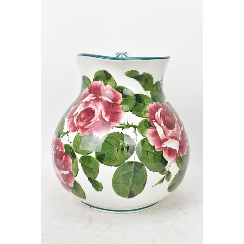 94 - An early 20th century Wemyss 'Cabbage Roses' pattern wash jug and bowl, painted in polychrome with f... 