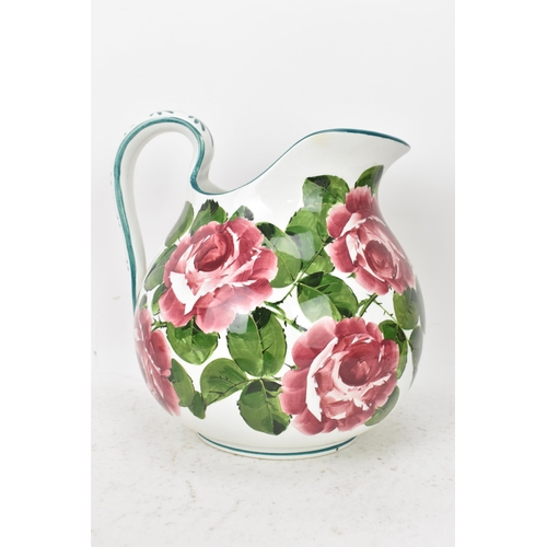 94 - An early 20th century Wemyss 'Cabbage Roses' pattern wash jug and bowl, painted in polychrome with f... 