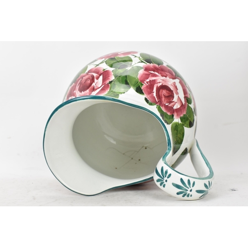 94 - An early 20th century Wemyss 'Cabbage Roses' pattern wash jug and bowl, painted in polychrome with f... 