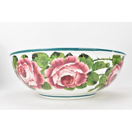 94 - An early 20th century Wemyss 'Cabbage Roses' pattern wash jug and bowl, painted in polychrome with f... 