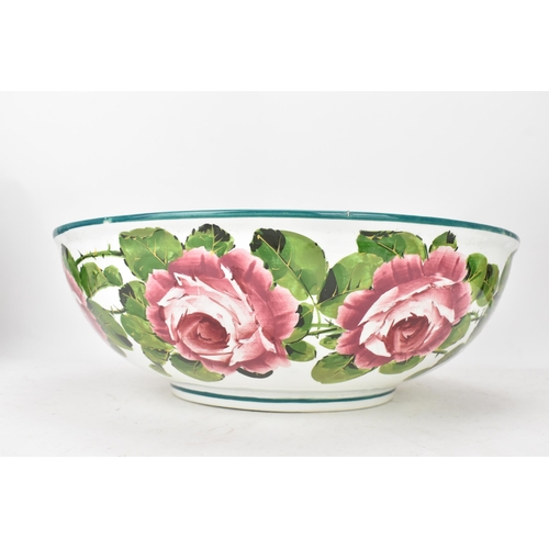 94 - An early 20th century Wemyss 'Cabbage Roses' pattern wash jug and bowl, painted in polychrome with f... 