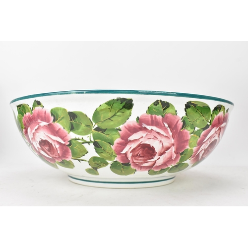 94 - An early 20th century Wemyss 'Cabbage Roses' pattern wash jug and bowl, painted in polychrome with f... 