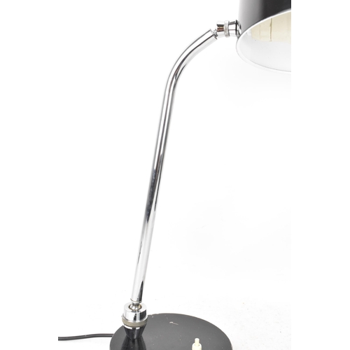 98 - A mid century modern desklamp, designed by André Mounique for French company Jumo, having a black en... 