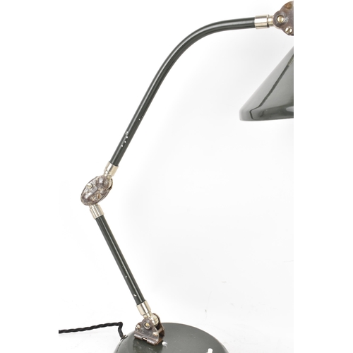 99 - A 1960s retro desklamp by the French company Jumo, model GS1, having a dark green enamelled shade, a... 