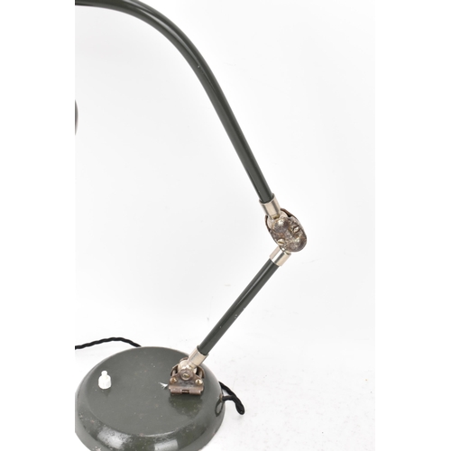 99 - A 1960s retro desklamp by the French company Jumo, model GS1, having a dark green enamelled shade, a... 