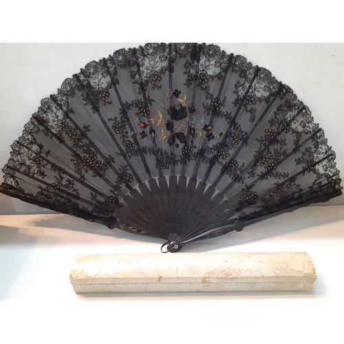 34 - A late 19th Century black lace fan with embroidered metallic thread detail together with original fa... 