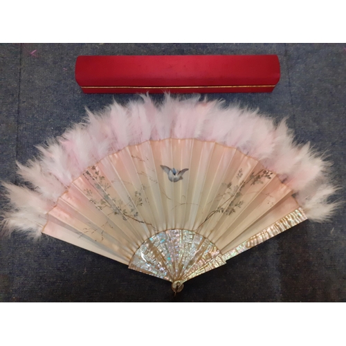 35 - Duvelleroy, Paris-A cream silk fan with pink hues having a hand-painted scene of a bird inflight bet... 