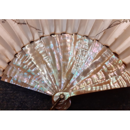 35 - Duvelleroy, Paris-A cream silk fan with pink hues having a hand-painted scene of a bird inflight bet... 